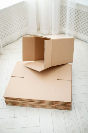 Empty cardboard boxes of large size on a light colored backgroundの写真素材