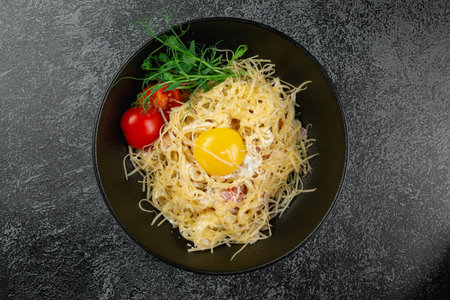 Pasta carbonara with bacon and egg yolkの写真素材