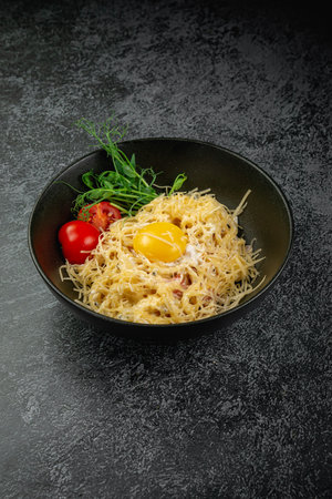 Pasta carbonara with bacon and egg yolkの写真素材