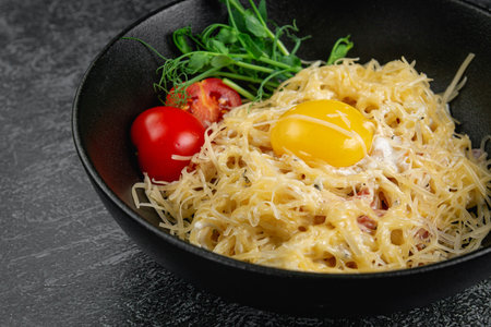 Pasta carbonara with bacon and egg yolkの写真素材