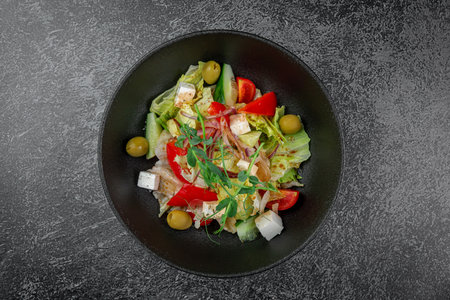 Caesar salad with croutons, cherry tomatoes, olives, cucumber and red onionの写真素材