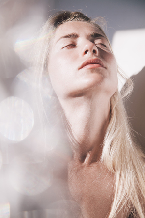 portrait of girl who appears from sunbeamsの写真素材