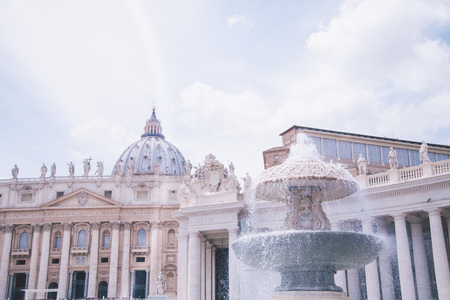 fountain in front of Saint Peters basilica in Vaticanの写真素材