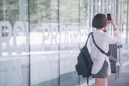 girl takes photo in museum of architecture in romeの写真素材