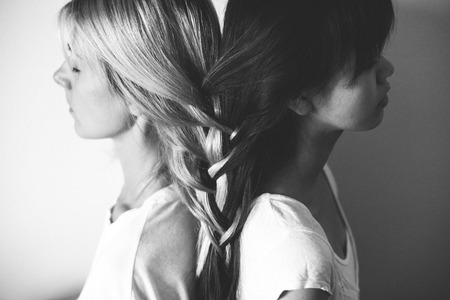 blonde and brunette hair braided together in black and whiteの写真素材