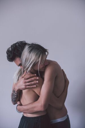 girl and boy hugging on white backgroundの写真素材