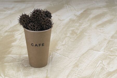 Recycled cardboard coffee cup with natural pinches ballsの写真素材