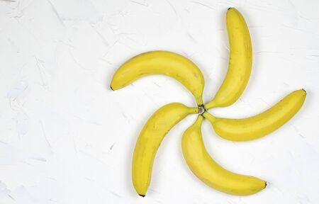 yellow bananas forming helixの写真素材