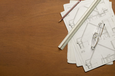 Work plan and drawing elements on wooden table