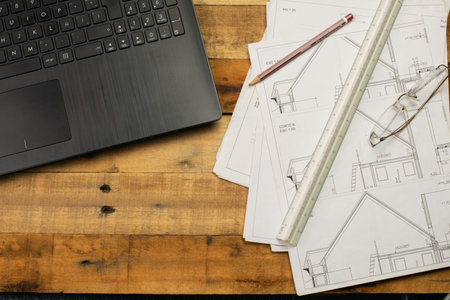 Work plan, drawing elements and notebook on rustic wooden tableの写真素材