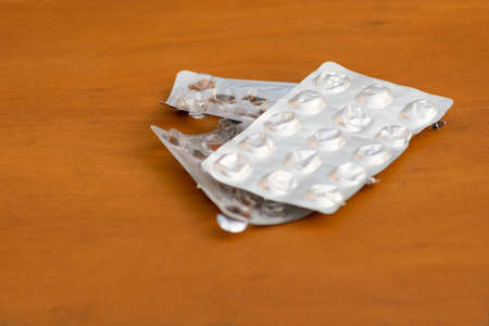 Several medicine empty pack on wooden backgroundの写真素材