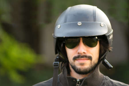 man with motorcycle helmet looking straight aheadの写真素材