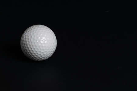 Golf pellet on black backgroundの写真素材