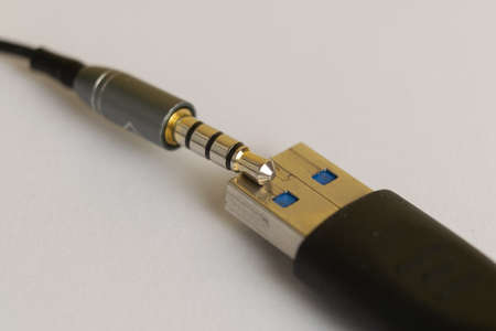 Audio plug from headphone or music device with USB connector