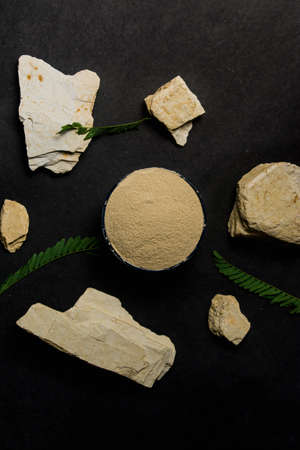 organic dry clay powder on white background. natural clay powder for cosmetic industry, spa or home useの写真素材