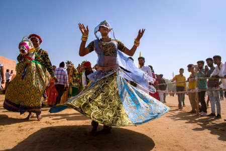Jaisalmer, Rajasthan, India - 02 27 2021: local woman dancer dances on in the desert festivalのeditorial素材