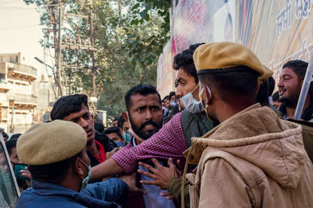 Jaisalmer, Rajasthan, India - January 12 2021: man fights with the police in crowded placeのeditorial素材