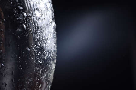 Large and fine water drops on glass.
