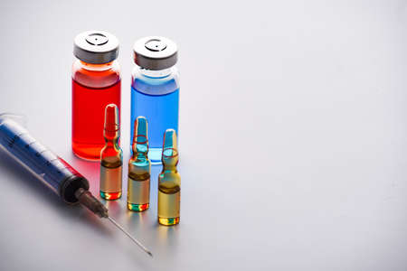 medical ampoules for injection and syringe. medicines and disease treatment. pharmacology and scienceの写真素材