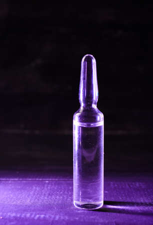 medical ampoules with liquid on a gray background close-upの写真素材