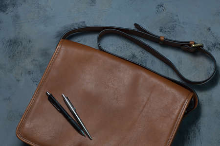 Brown Leather Shoulder Bag There is a pen on the bag.の写真素材