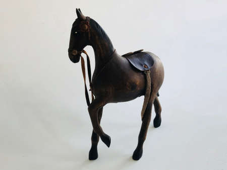 A wooden brown horse isolated on whiteの写真素材