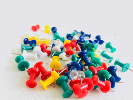 detail the different colored pins on a white backgroundの写真素材