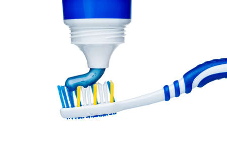 Toothpaste on blue toothbrush