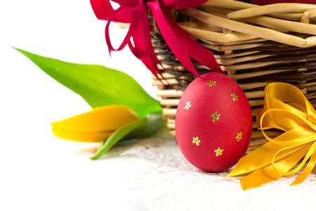 Easter basket with Easter Eggs and tulips