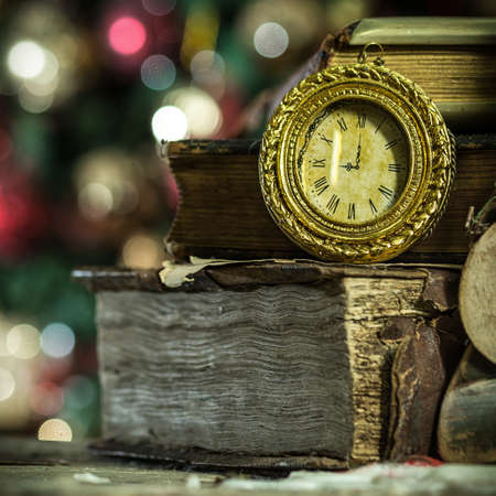 Old books and vintage clock on Christmas background  New year card in retro style の写真素材