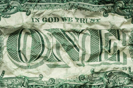 Crumpled dollar bills isolated on white backgroundの写真素材