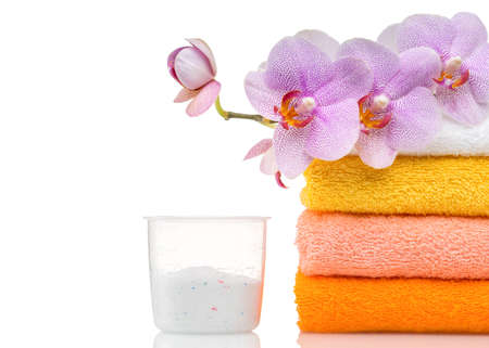Detergent for washing machine in laundry with towels in the white background の写真素材