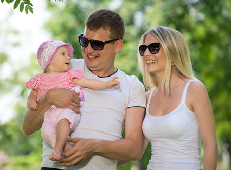 Portrait Of Happy Family In Garden