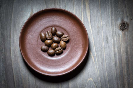 Coffee beans on wooden backgroundの写真素材