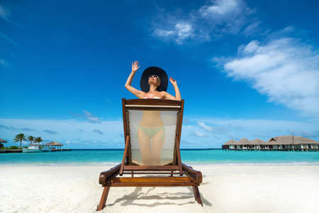 Woman in bikini at tropical beachの写真素材