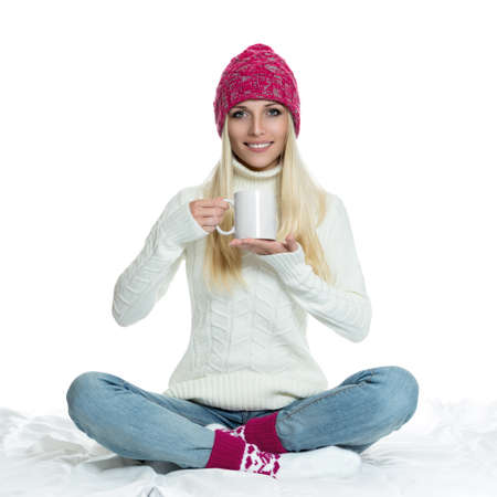 Beautiful woman holding white cupの写真素材