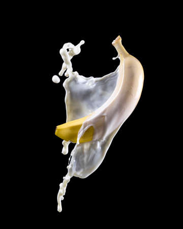 banana with milk splash on black bacgroundの写真素材