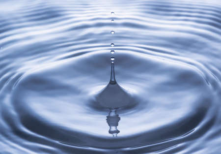 Blue water drop falling down, water splashの写真素材