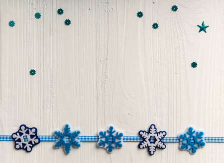Christmas decoration on a background of white painted rustic boards with copyspaceの写真素材