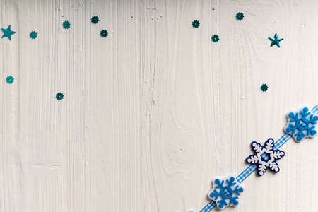 Christmas decoration on a background of white painted rustic boards with copyspaceの写真素材