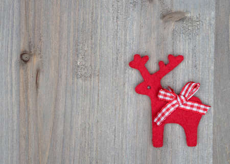 Christmas Reindeer on wooden backgroundの写真素材