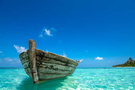 Perfect tropical island paradise beach and old boatの写真素材