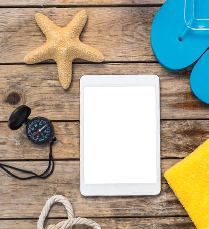 Wooden background with starfish, tadlet and shell - maritime decoration.の写真素材