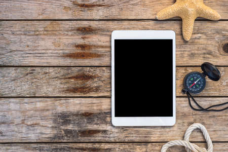 Wooden background with starfish, tadlet and shell - maritime decoration.の写真素材