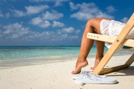 Beach vacation. Hot beautiful woman enjoying looking view of beach