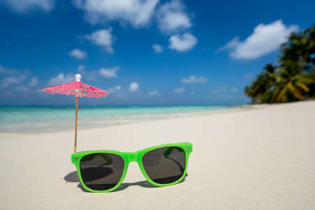 Picture of sunglasses on the tropical beach, vacation. Traveller dreams conceptの写真素材