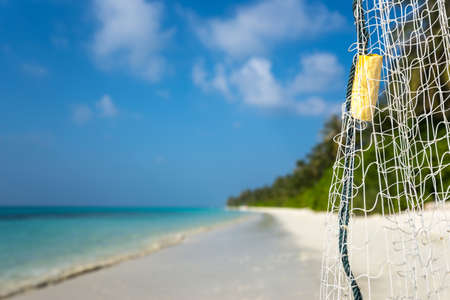 fishing net on a tropical beach backgroundの写真素材