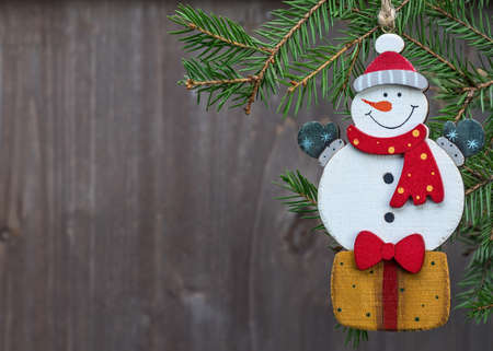 Toy snowman Christmas decoration. Vintage style, white background, with copy space for your text.の写真素材