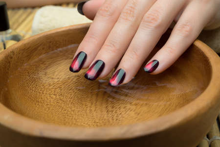 Beautiful woman's nails with nice stylish manicure.の写真素材