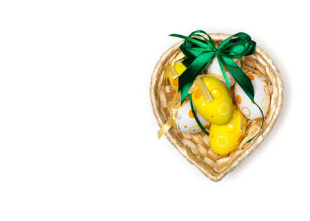 Easter eggs in a wicker basketの写真素材